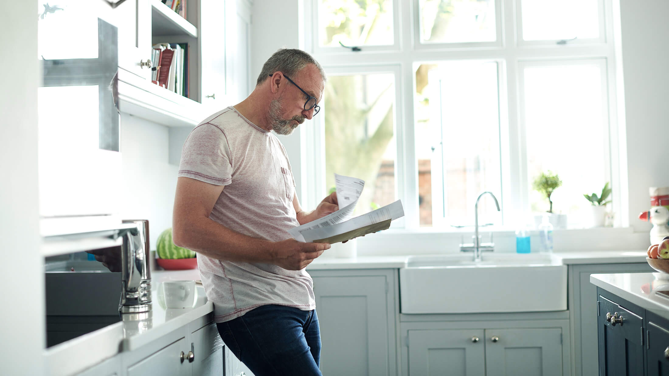 Mature man reading documents