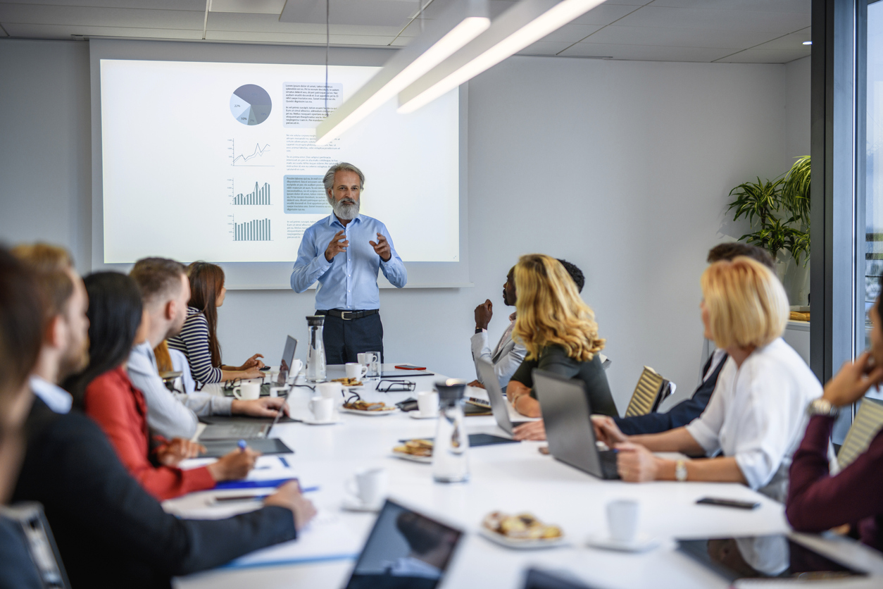 Mature Businessman Explaining Forecasting Details